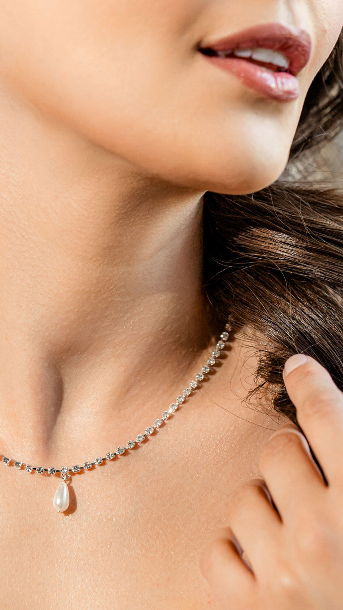 Elegant bridal necklace detail with pearl pendant