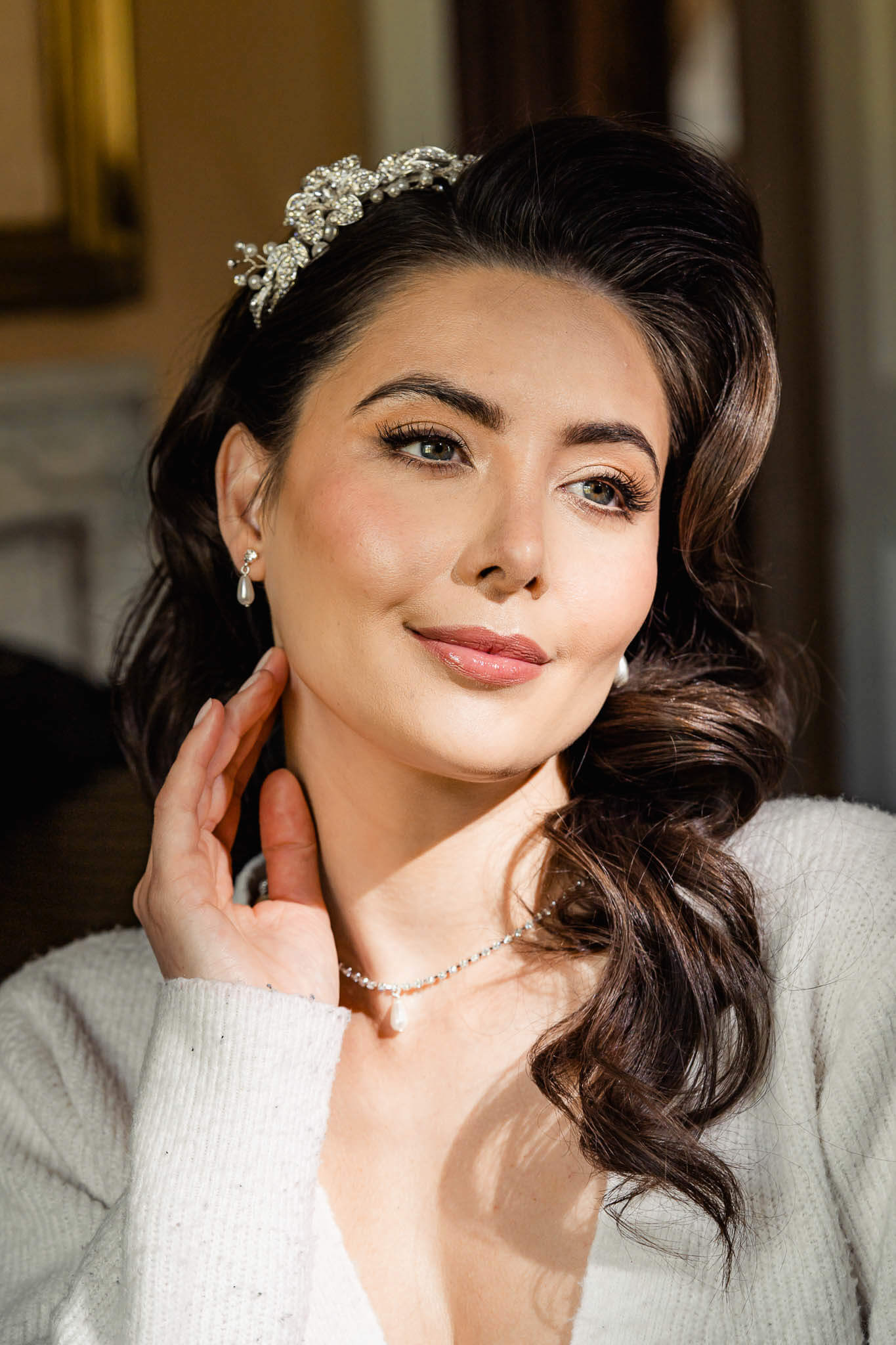 Close portrait of bride wearing a jeweled hairpiece during bridal portraits at Hazlewood Castle