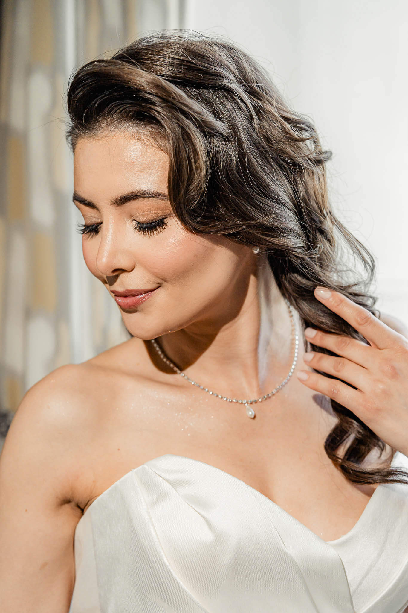 Bride smiling softly during bridal portrait session at Hazlewood Castle in Yorkshire