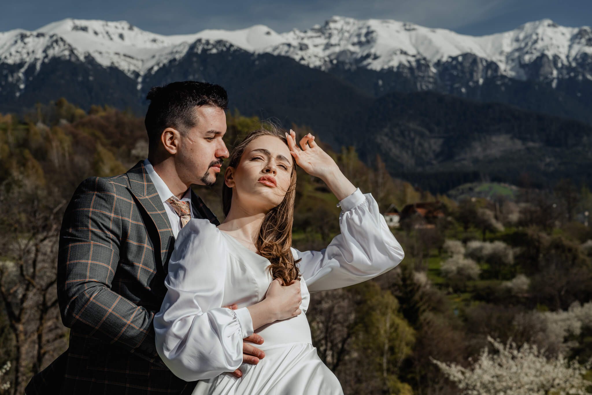 Modern bridal inspiration editorial couple portrait in mountain landscape with soft natural light