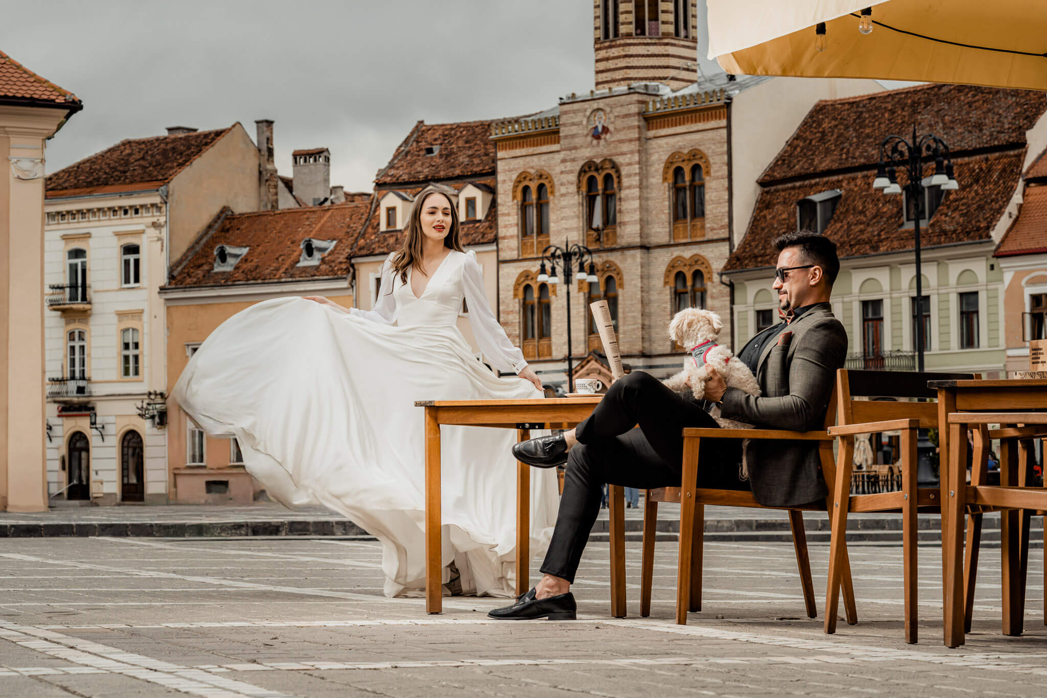 editorial wedding couple portrait with flowing bridal dress in city setting