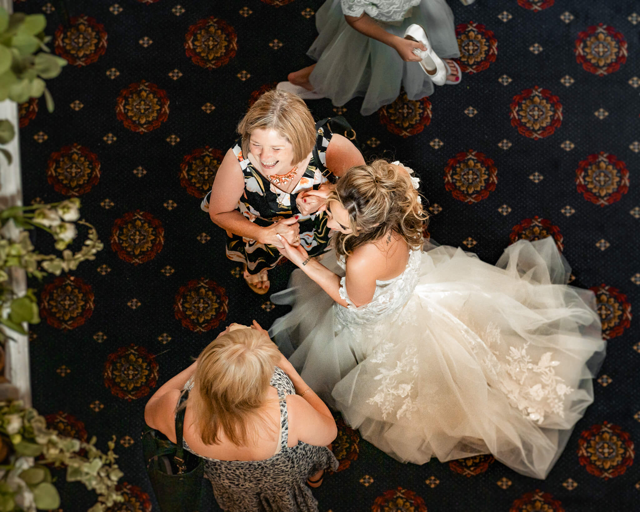 Bride laughing with guests captured from above