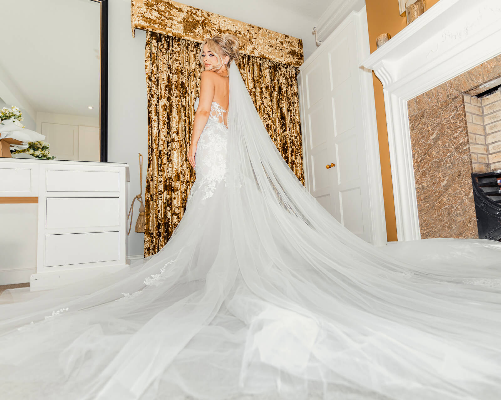 Bride with long flowing veil in wedding dress at Colshaw Hall Country Estate