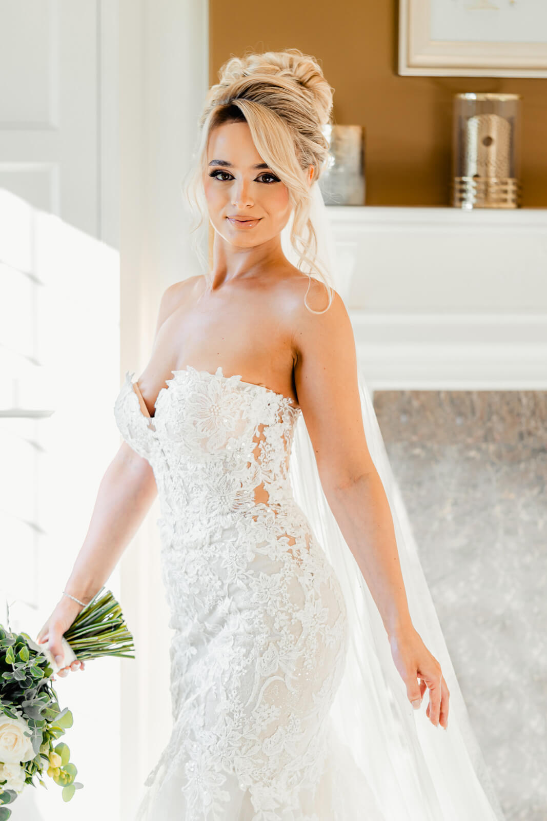 Bride walking with bouquet in wedding dress at Colshaw Hall Country Estate