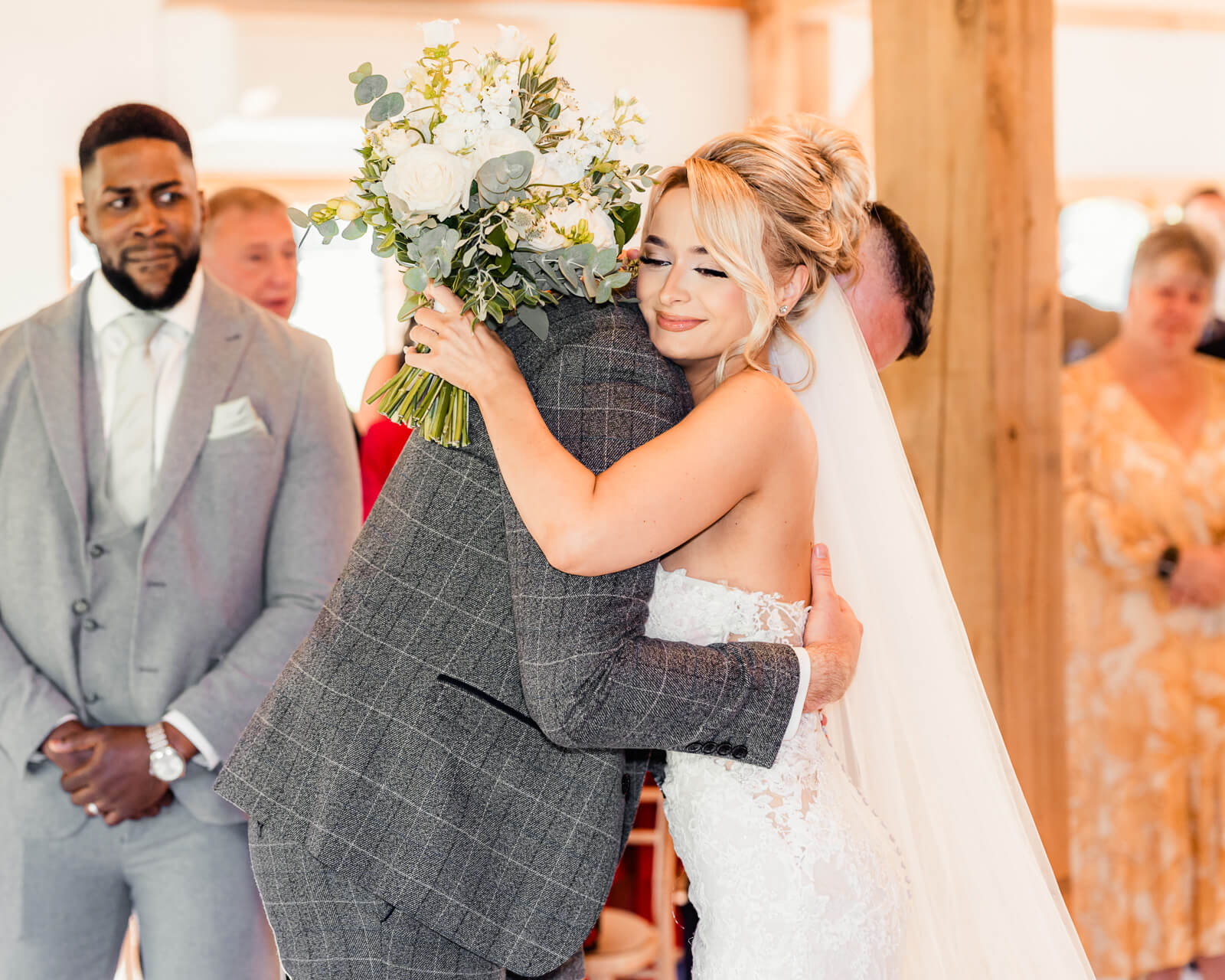 Bride hugging groom during Elegant Wedding at Colshaw Hall Country Estate ceremony