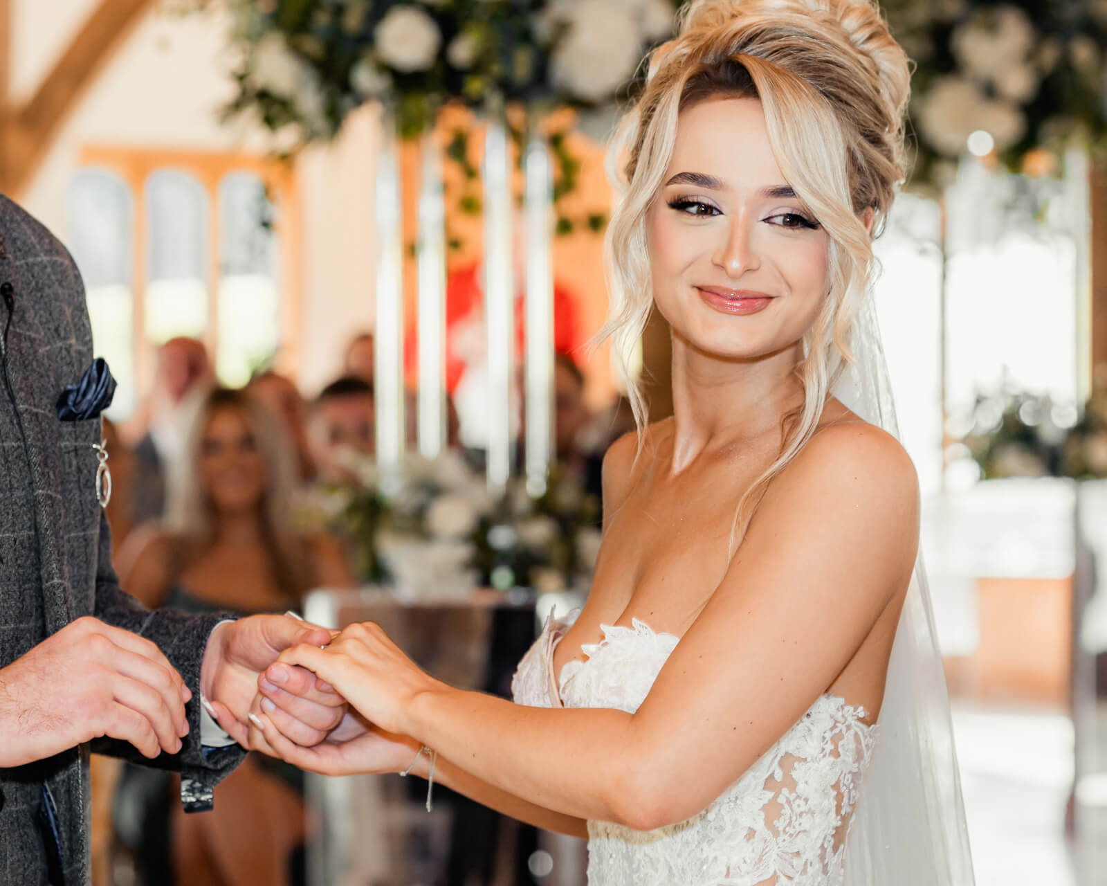 Bride holding hands during ceremony at Elegant Wedding at Colshaw Hall Country Estate