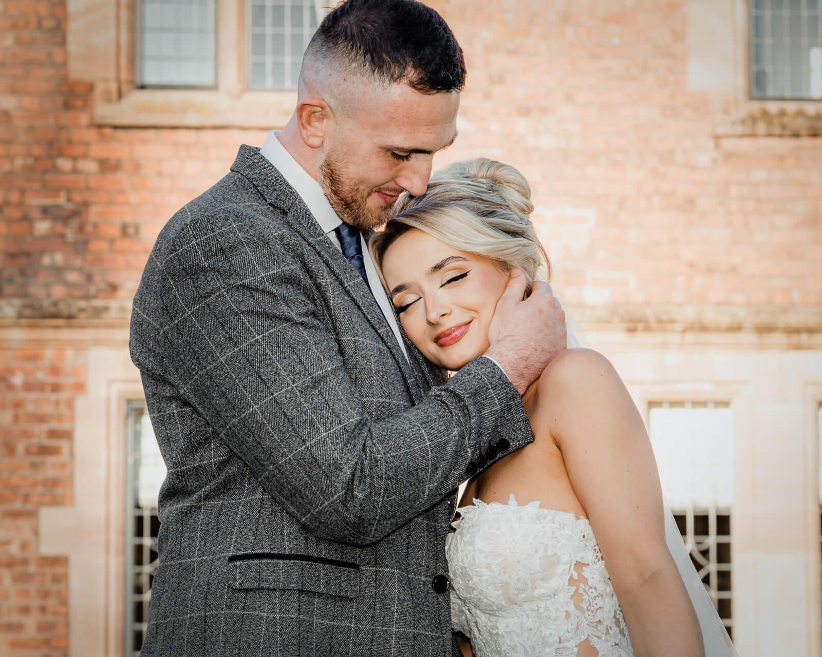 Bride and groom embracing during Elegant Wedding at Colshaw Hall Country Estate