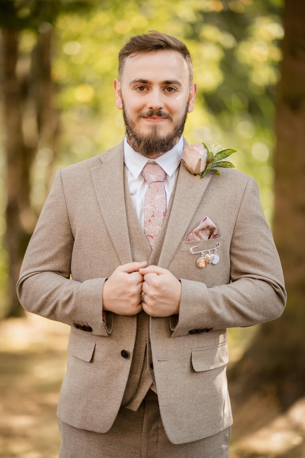 Groom portrait at Chevin Country Park wedding in woodland setting