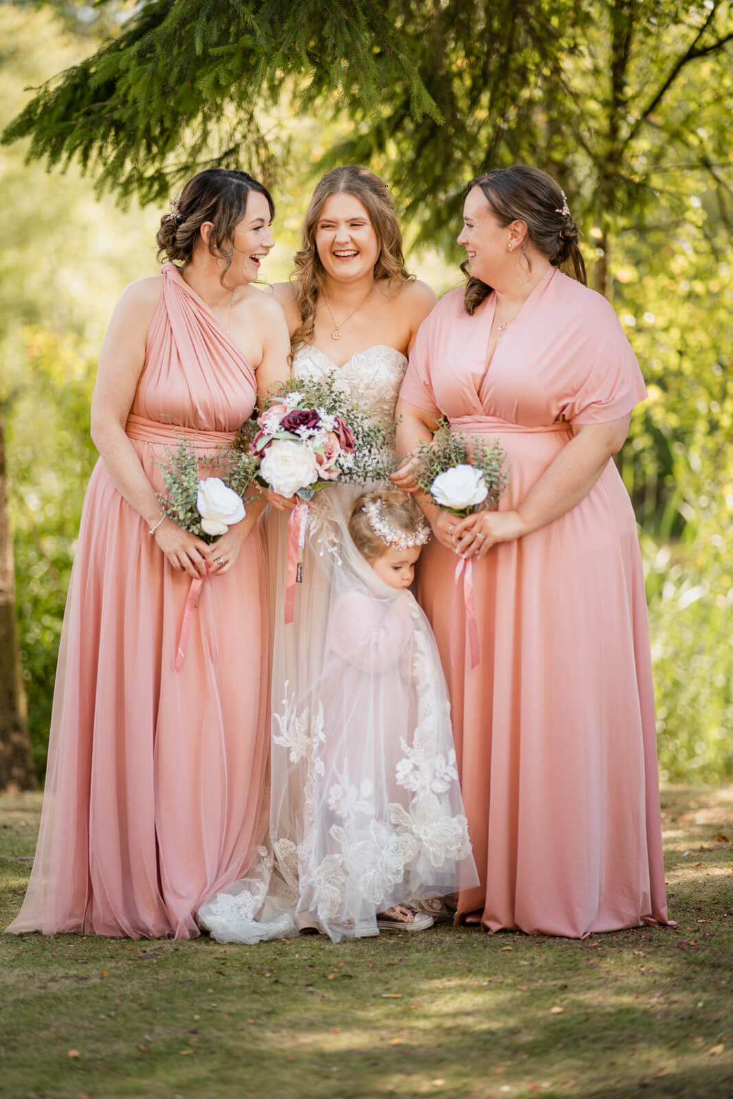 Bride with bridesmaids and flower girl at Chevin Country Park woodland setting