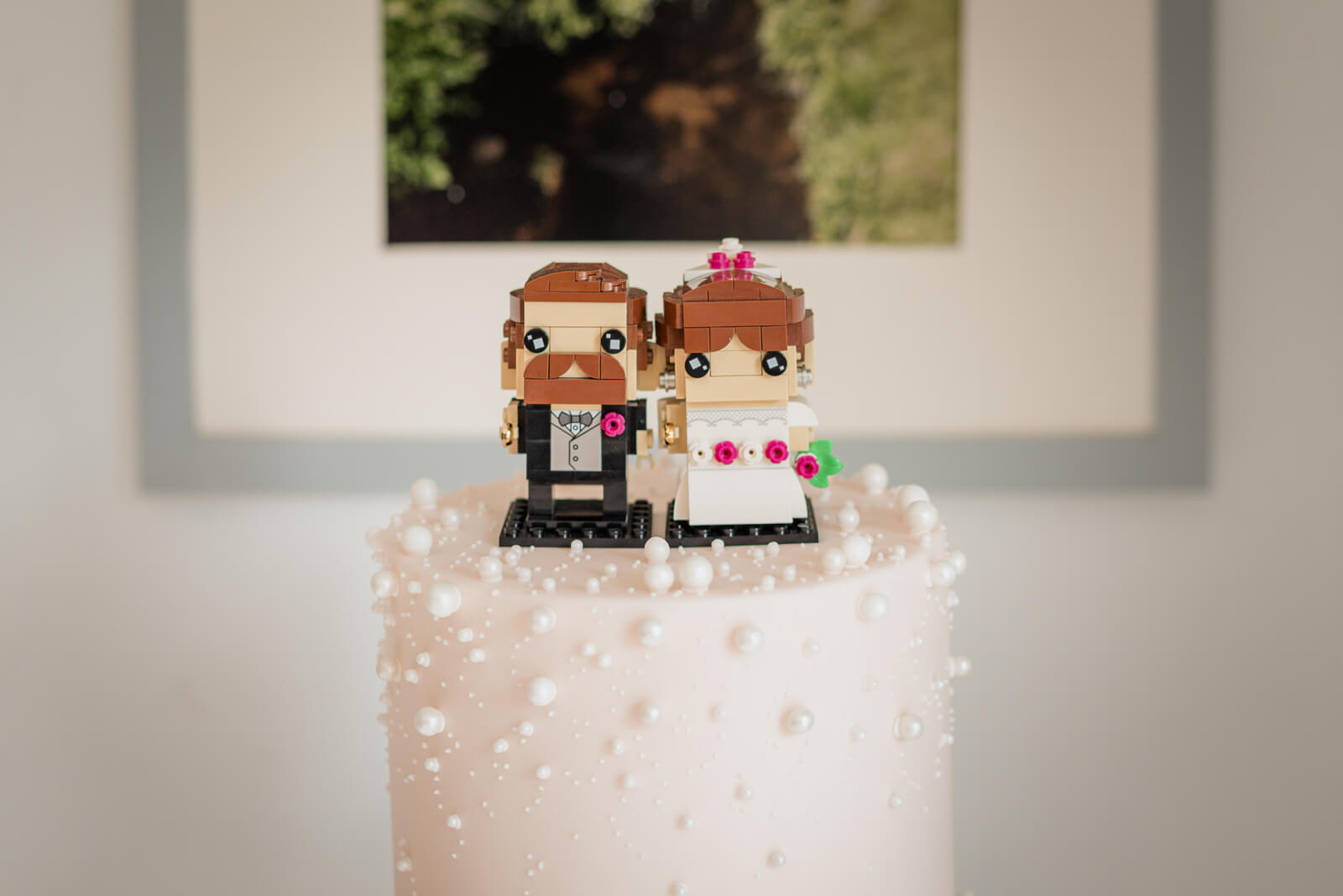LEGO bride and groom cake topper on wedding cake at Chevin Country Park
