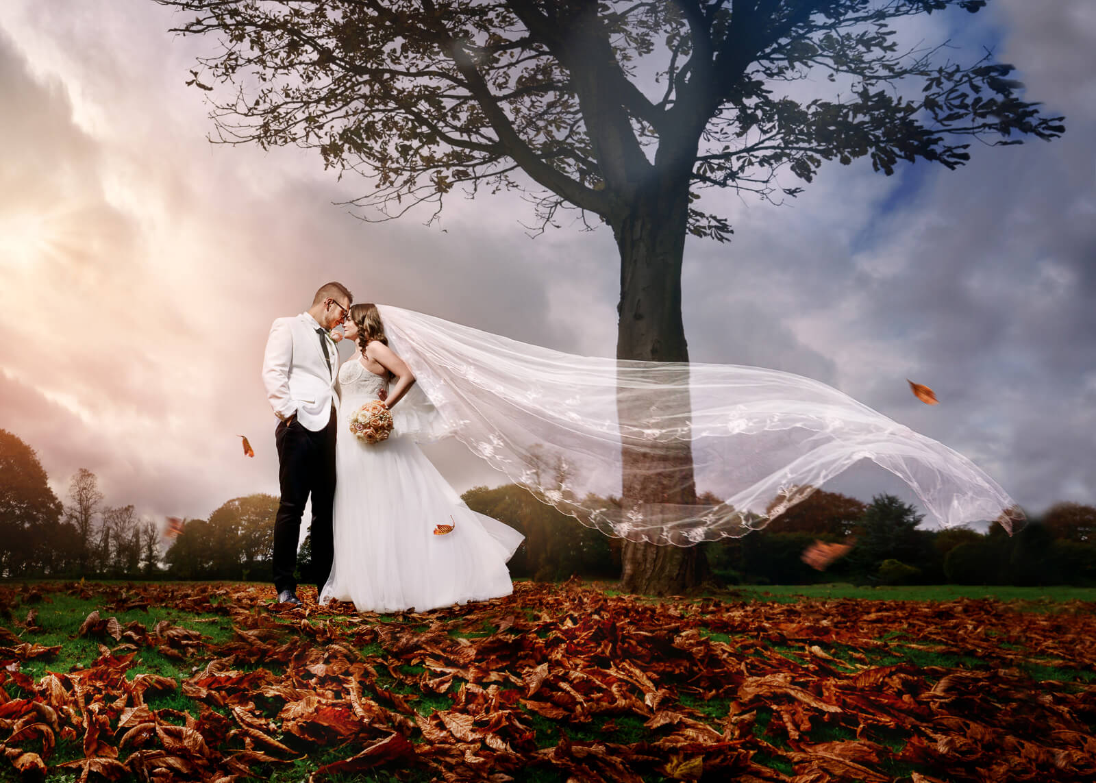 wedding couple with flowing veil in autumn landscape in Yorkshire