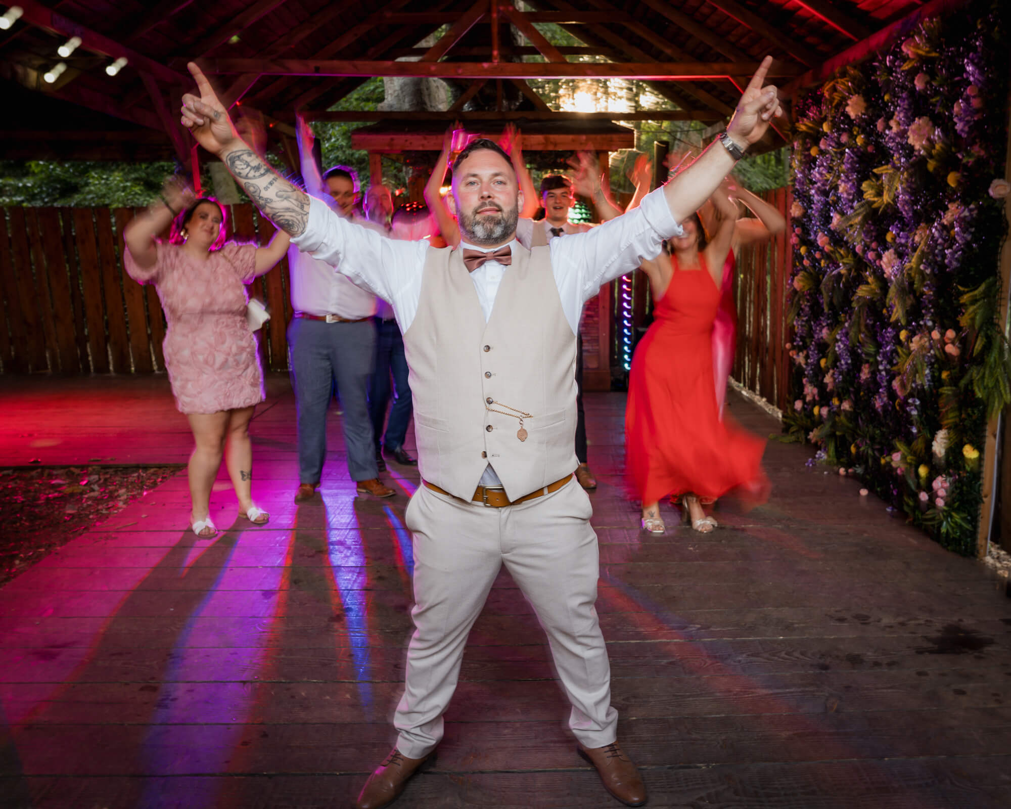 Groom leading the dance floor celebrations at Hazlewood Castle wedding.
