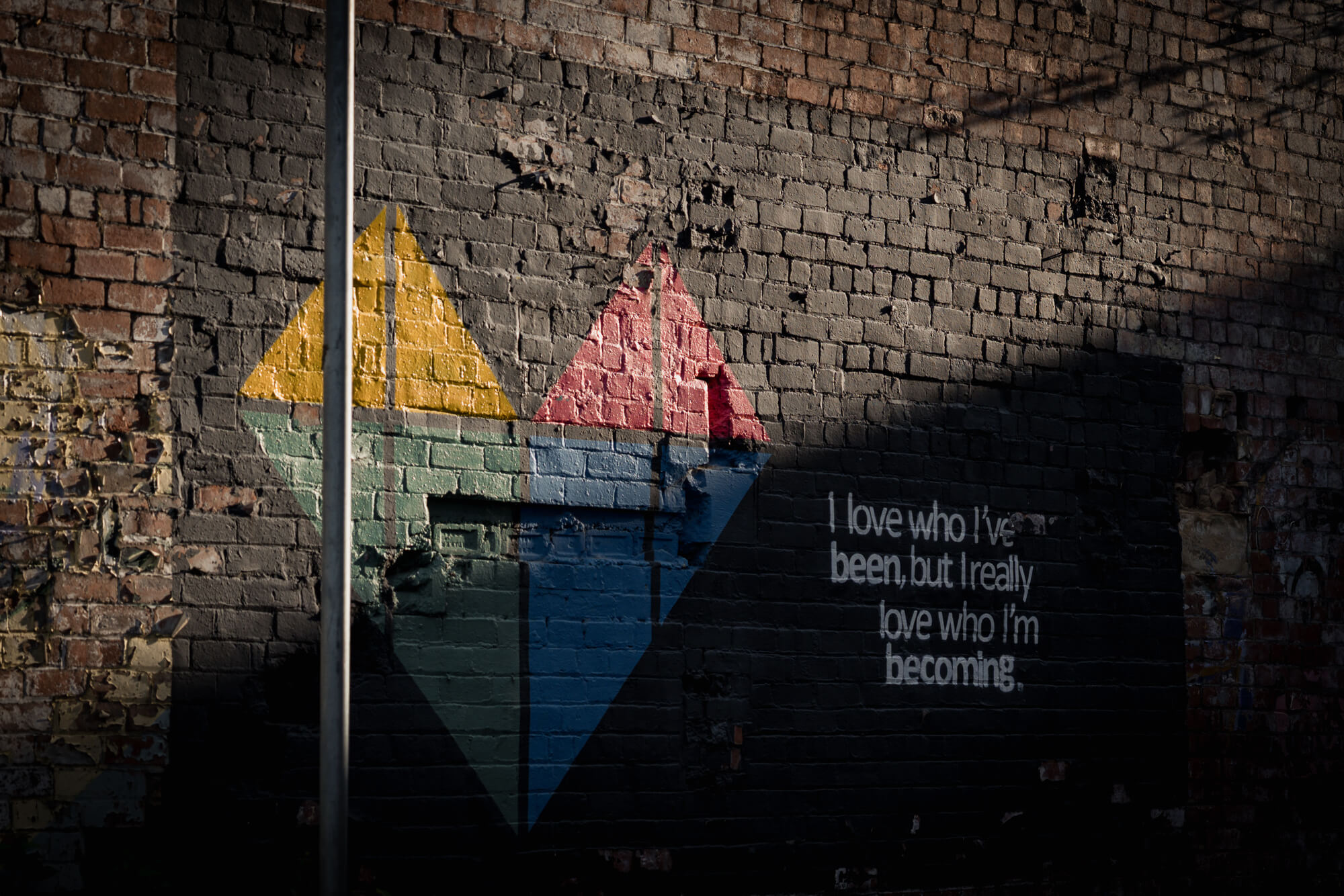 Colourful geometric mural in Leeds city centre symbolising love and new beginnings.