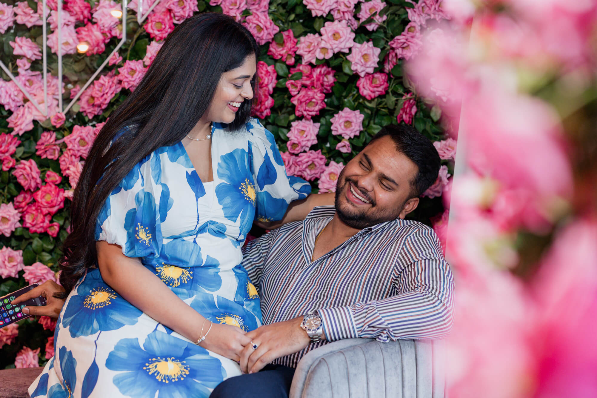 Romantic portrait surrounded by pink flowers during a Leeds pre-wedding shoot.