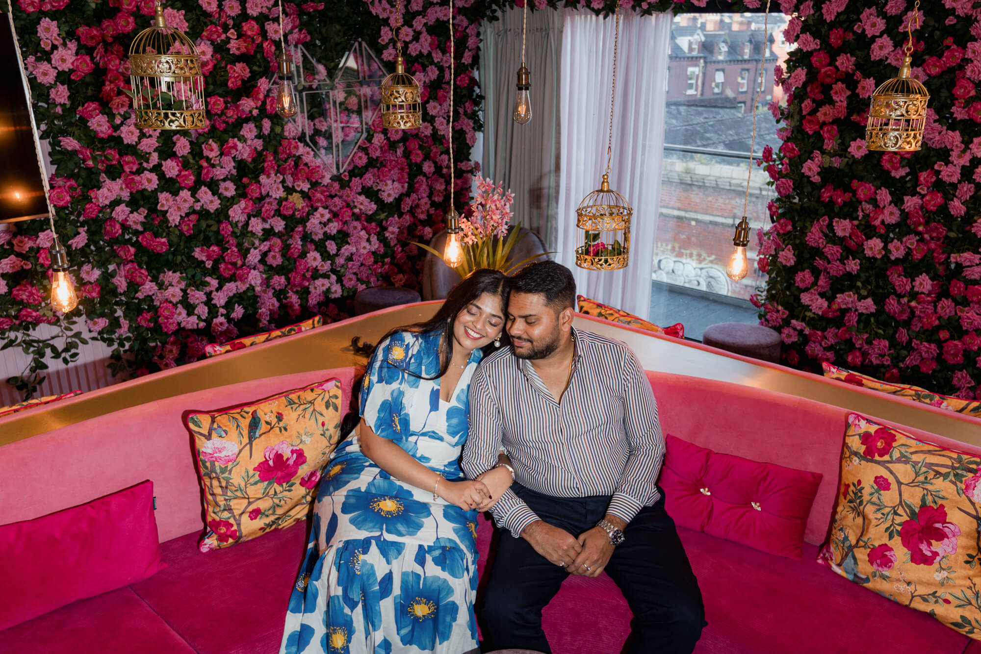 Couple relaxing together inside a floral lounge during a Leeds pre-wedding photoshoot.
