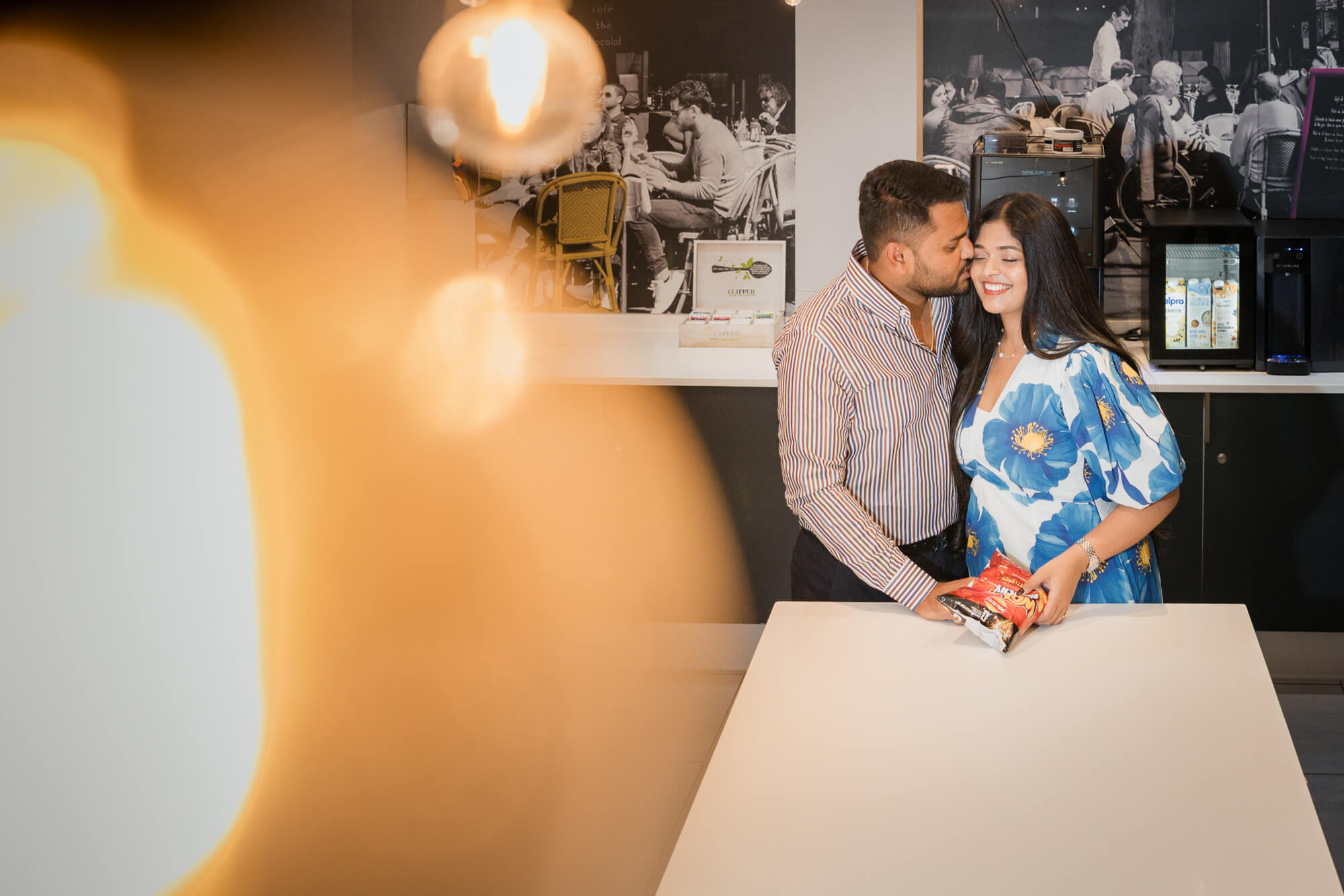 Couple sharing a romantic moment inside Iconinc Leeds kitchen area.