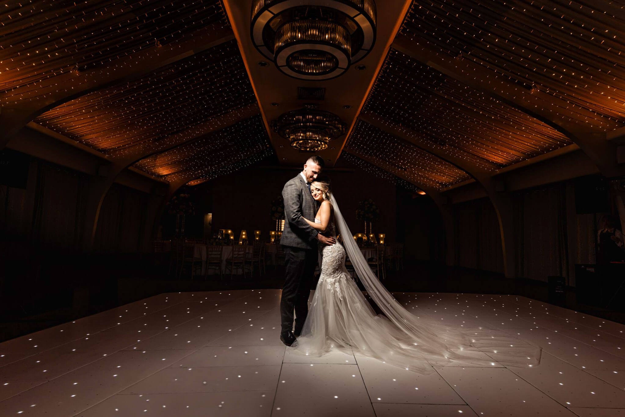 Groom and bride hugging each other at the venue Colshow Hall Country Estate.